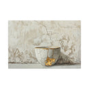 Kintsugi-inspired bowl featuring gold repairs against a textured background, symbolizing beauty in imperfection.